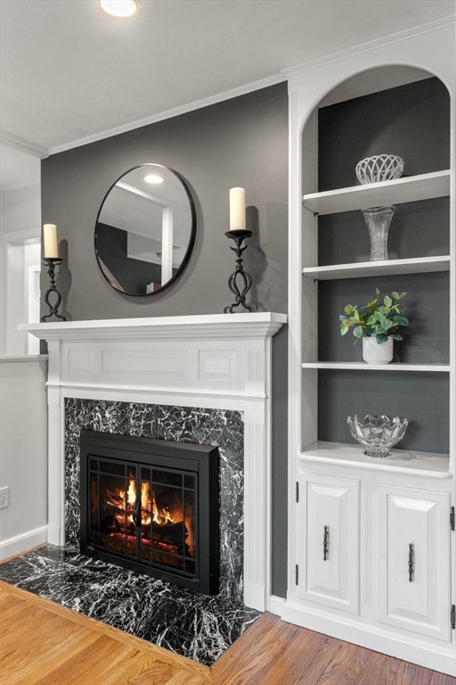 37 Benjamin Road Marlborough, MA 01752 - Photo 20 of 39 a living room with a fireplace and cabinets