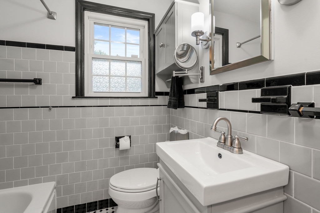 37 Benjamin Road Marlborough, MA 01752 - Photo 23 of 39 a bathroom with a toilet sink and mirror