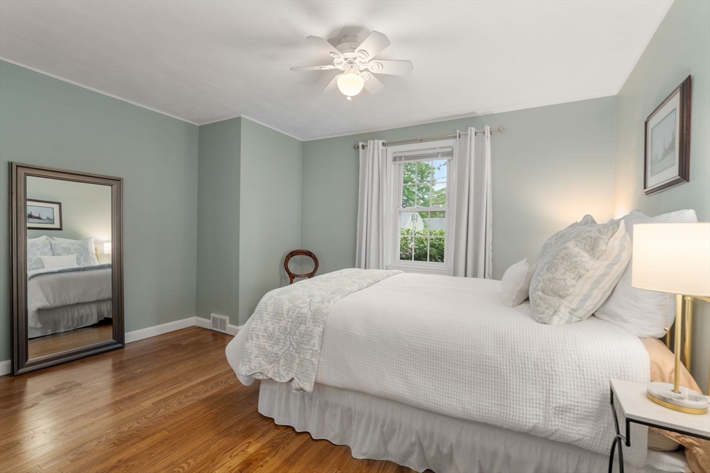 37 Benjamin Road Marlborough, MA 01752 - Photo 25 of 39 a bedroom with a bed and a chandelier