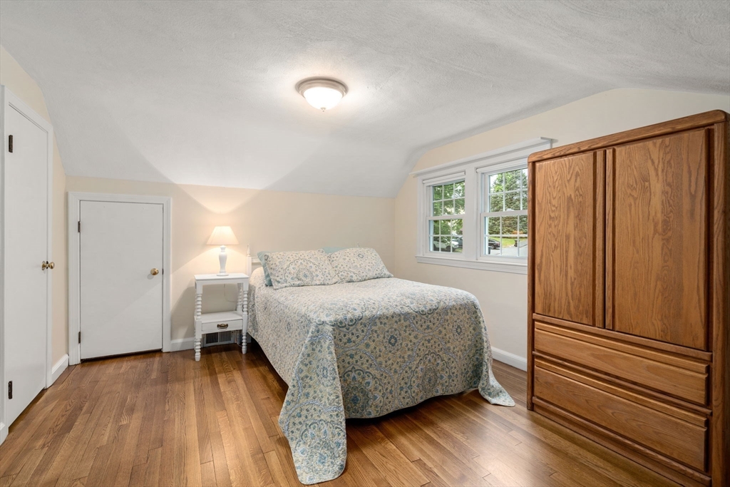 37 Benjamin Road Marlborough, MA 01752 - Photo 28 of 39 a bedroom with a bed and wooden floor