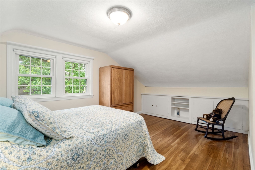 37 Benjamin Road Marlborough, MA 01752 - Photo 29 of 39 a bedroom with a bed a chair and a dresser next to a window