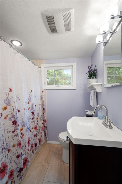 37 Benjamin Road Marlborough, MA 01752 - Photo 33 of 39 a bathroom with a sink and mirror with toilet