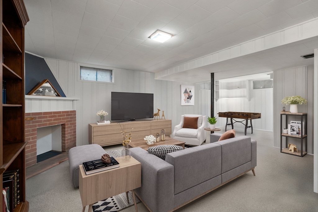 37 Benjamin Road Marlborough, MA 01752 - Photo 34 of 39 a living room with furniture and a fireplace