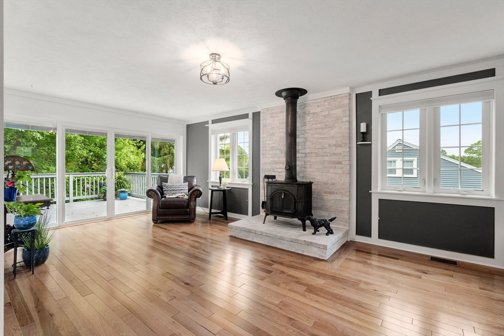 37 Benjamin Road Marlborough, MA 01752 - Photo 5 of 39 a living room with furniture large window and a fireplace