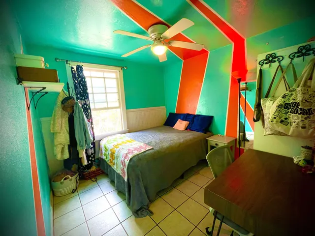 a front view of a house with swimming pool and glass windows
