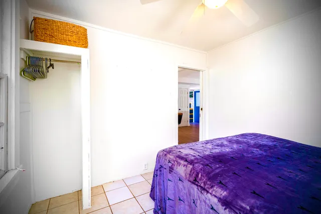 a bathroom with a sink a toilet a mirror and shower