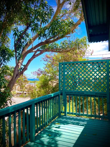 a view of a chairs and table in the patio