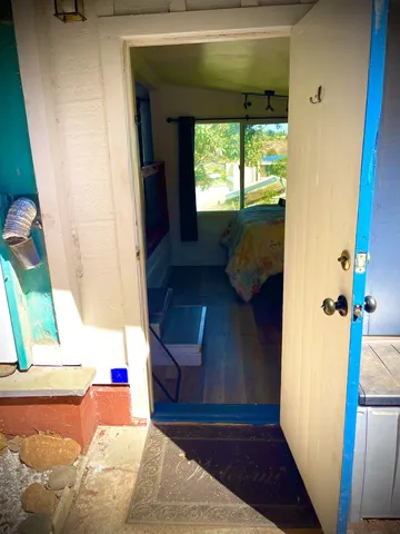 a kitchen with kitchen island and stainless steel appliances