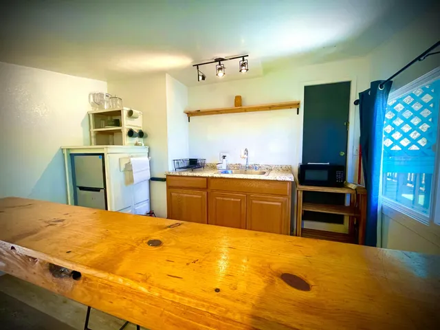 a view of kitchen with furniture and a fireplace