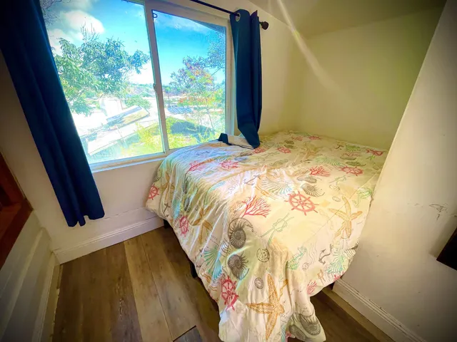a bathroom with a shower and a shower curtain