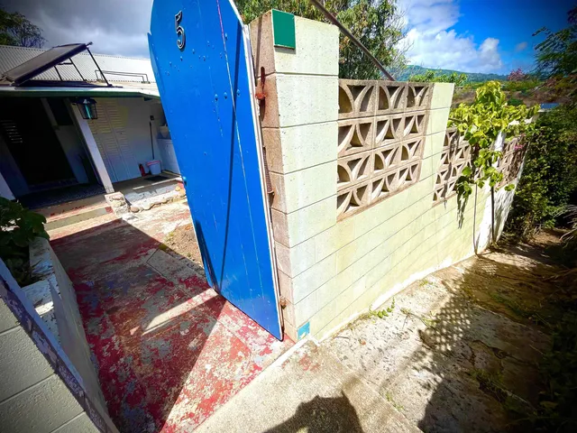 a front view of a house with a large window
