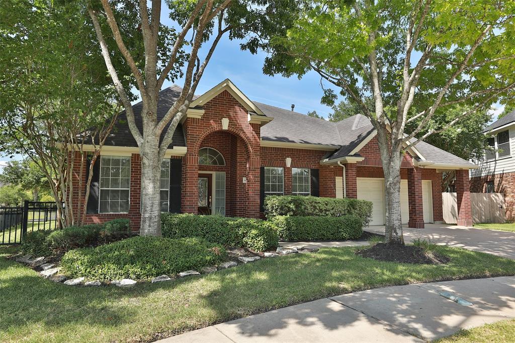 Welcome to this lovely home in Katy's Grand Lakes surrounded by mature trees and lush landscaping.
