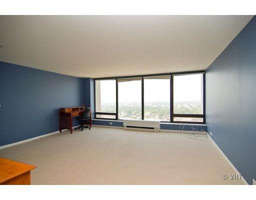 5445 North Sheridan Road, Unit 2503 Chicago, IL 60640 - Photo 2 of 7 a view of a room with furniture and floor to ceiling window