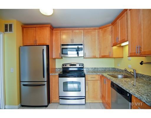 5445 North Sheridan Road, Unit 2503 Chicago, IL 60640 - Photo 4 of 7 a kitchen with a refrigerator sink and stove