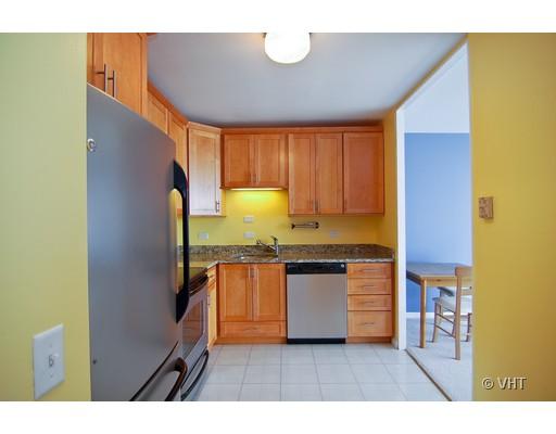 5445 North Sheridan Road, Unit 2503 Chicago, IL 60640 - Photo 5 of 7 a kitchen with stainless steel appliances granite countertop a refrigerator a sink and a stove