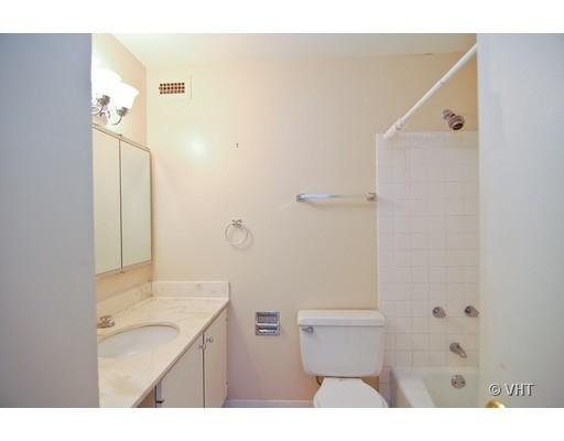 5445 North Sheridan Road, Unit 2503 Chicago, IL 60640 - Photo 7 of 7 a bathroom with a sink a toilet and shower