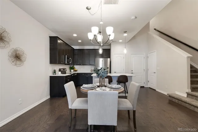a kitchen with a sink stainless steel appliances and cabinets