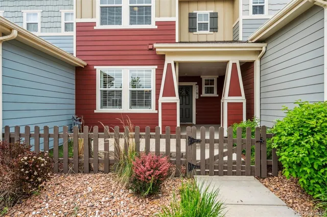a view of house with hallway and wooden fence