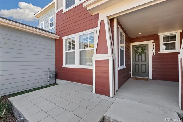 a view of a dining room with furniture wooden floor and chandelier