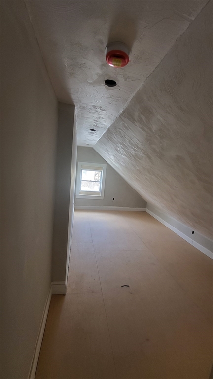 52 Willow Street, Unit 52 Lowell, MA 01852 - Photo 14 of 16 an empty room with windows