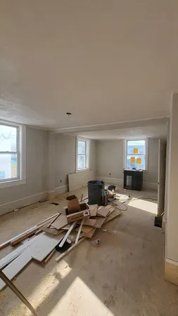 a living room with furniture and window