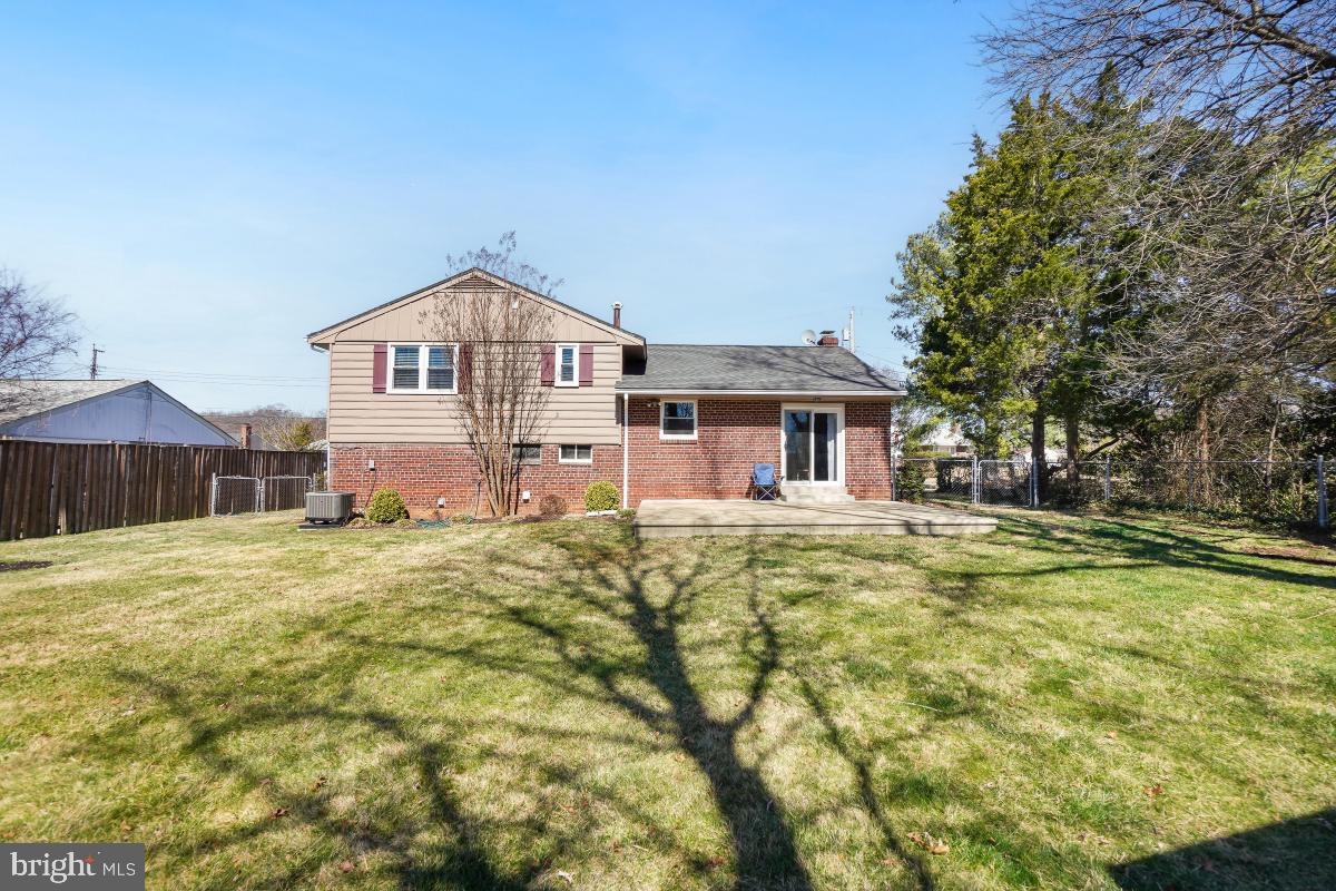 6703 Anders Terrace Springfield, VA 22151 - Photo 29 of 33 a front view of a house with a yard