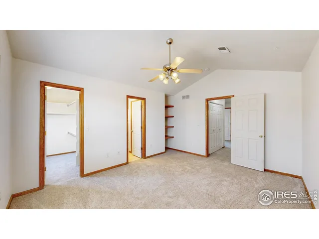 a upper view of a room with a ceiling fan