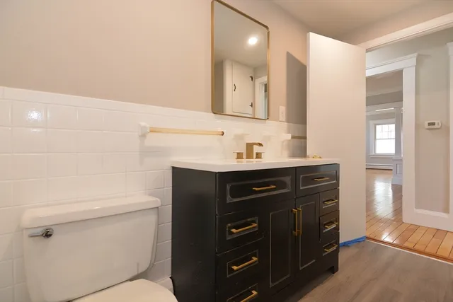 a bathroom with a sink vanity and mirror