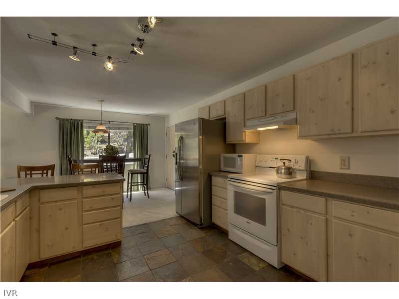 861 Jeffrey Street Incline Village, NV 89451 - Photo 5 of 13 a kitchen with stainless steel appliances granite countertop a sink and cabinets
