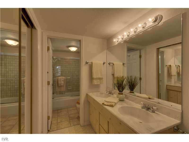 861 Jeffrey Street Incline Village, NV 89451 - Photo 8 of 13 a bathroom with a sink mirror and a shower
