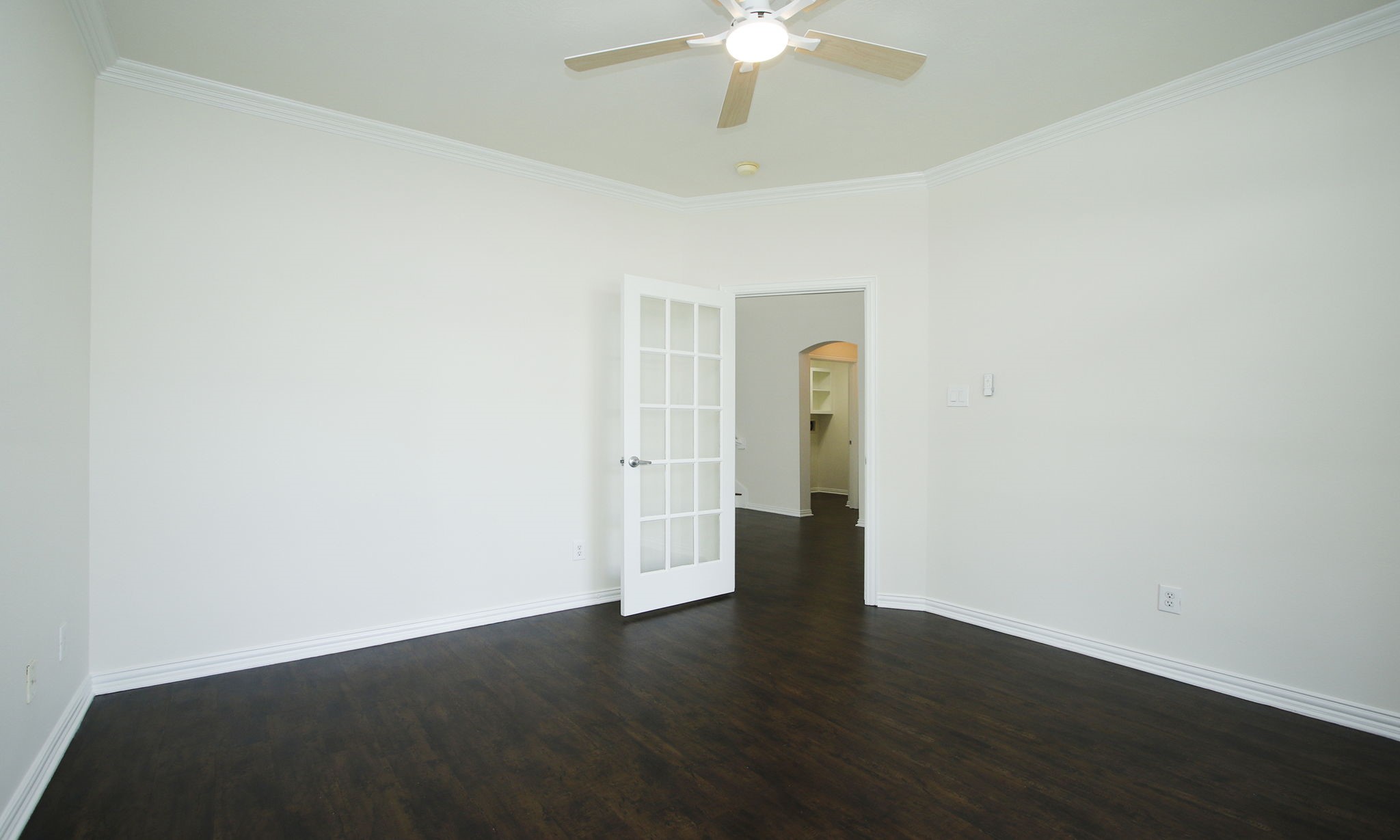 1210 Berwick Manor Court Spring, TX 77379 - Photo 14 of 50 an empty room with wooden floor and ceiling fan