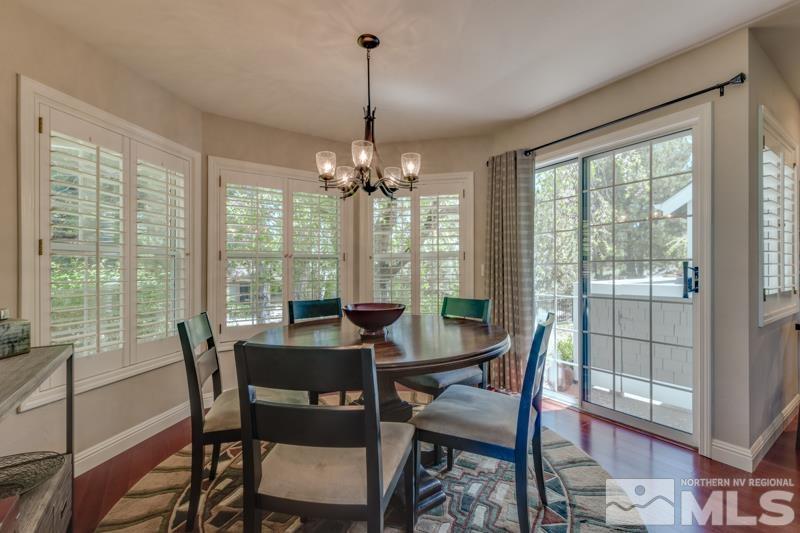 4275 Bitteroot Road Reno, NV 89519 - Photo 11 of 39 a dining room with furniture large windows and a chandelier