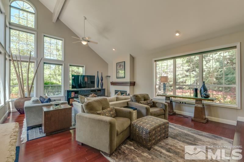 4275 Bitteroot Road Reno, NV 89519 - Photo 13 of 39 a living room with furniture large windows and wooden floor