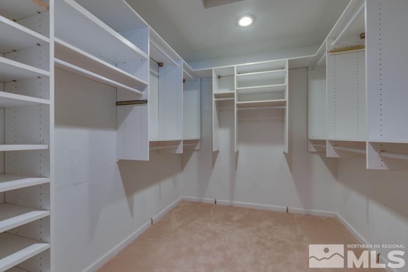 4275 Bitteroot Road Reno, NV 89519 - Photo 18 of 39 a view of an empty room with wooden floor and closet