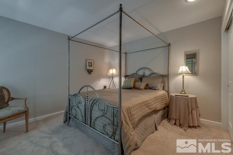 4275 Bitteroot Road Reno, NV 89519 - Photo 19 of 39 a bedroom with a bed and a chair
