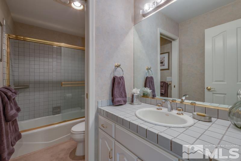 4275 Bitteroot Road Reno, NV 89519 - Photo 22 of 39 a bathroom with a sink a toilet and shower
