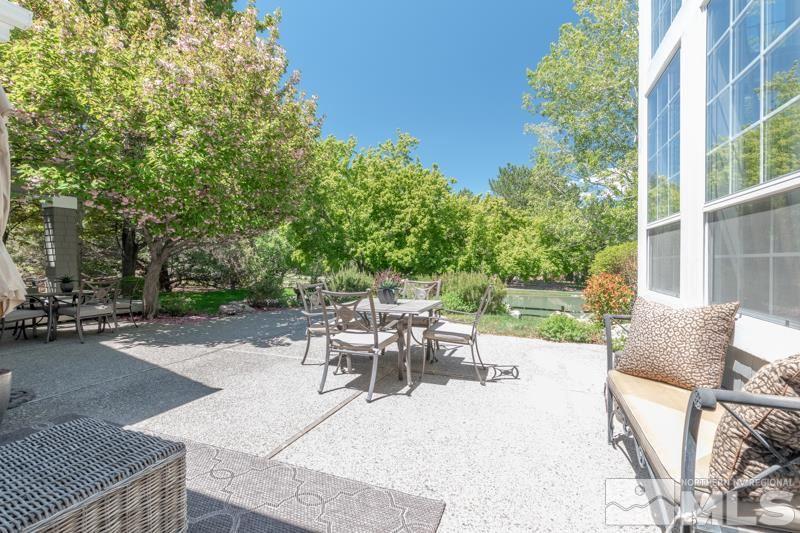 4275 Bitteroot Road Reno, NV 89519 - Photo 25 of 39 a view of a patio with a table and chairs and potted plants