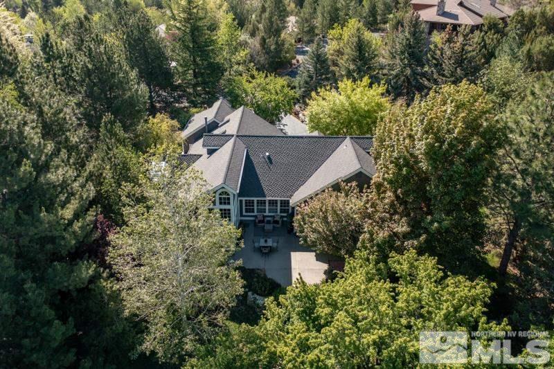 4275 Bitteroot Road Reno, NV 89519 - Photo 38 of 39 an aerial view of house with yard and trees in the background