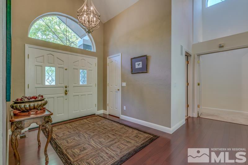 4275 Bitteroot Road Reno, NV 89519 - Photo 5 of 39 a bedroom with a bed and wooden floor