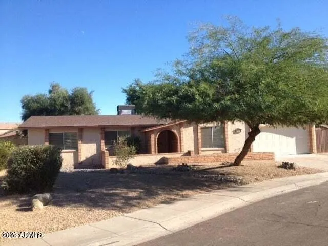 a front view of a house with yard