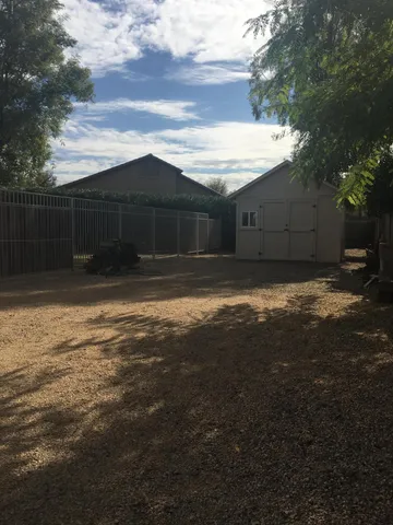 a view of tree in front of a house