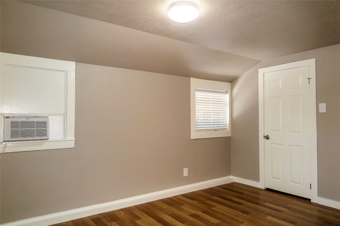 1312 A Pine Street, Unit A Georgetown, TX 78626 - Photo 16 of 26 a view of an empty room with wooden floor and a window