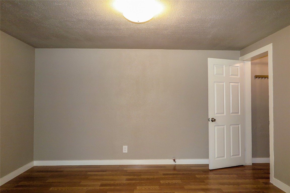 1312 A Pine Street, Unit A Georgetown, TX 78626 - Photo 21 of 26 a view of room with wooden floor
