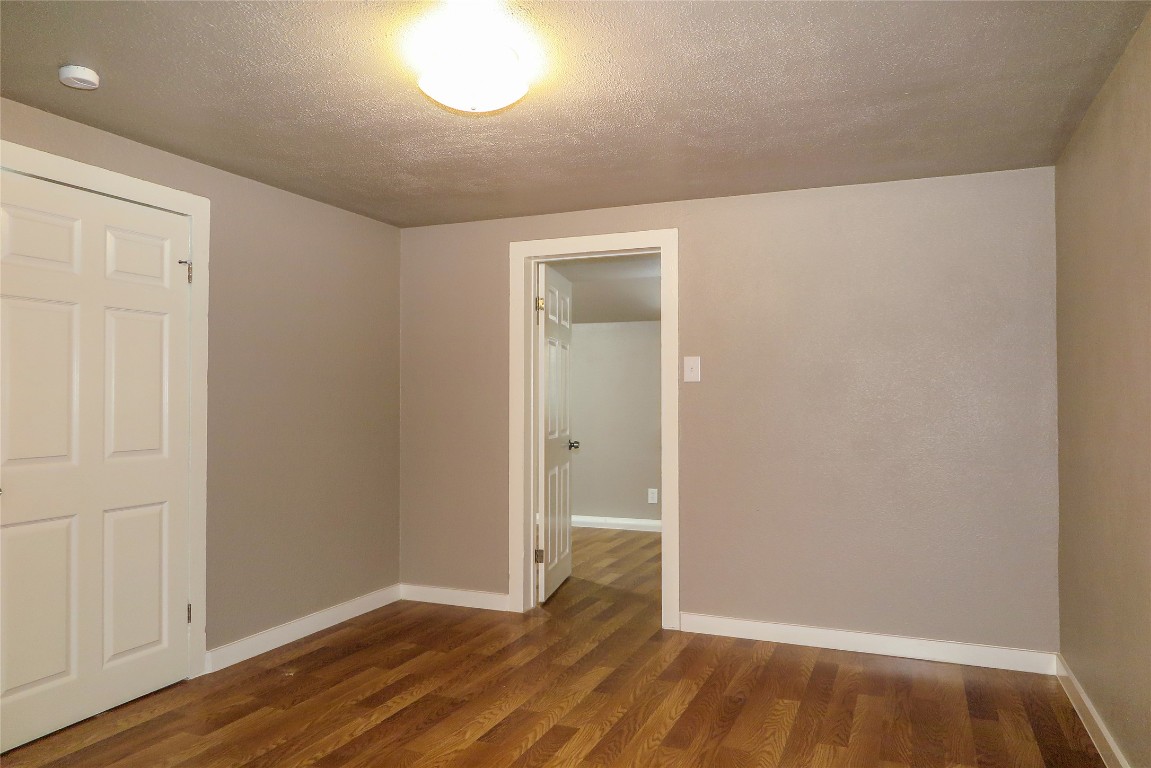 1312 A Pine Street, Unit A Georgetown, TX 78626 - Photo 22 of 26 an empty room with wooden floor and closet