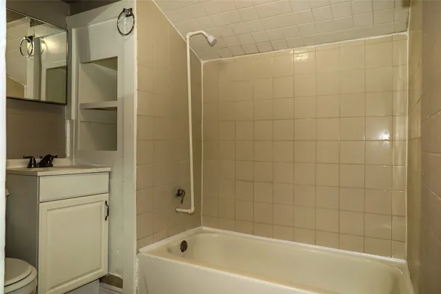 a bathroom with a bathtub a toilet and a sink