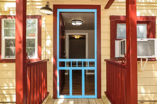 a view of a brick house with a large window