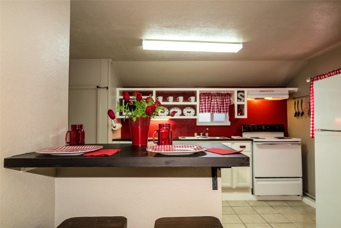 1312 A Pine Street, Unit A Georgetown, TX 78626 - Photo 9 of 26 a kitchen with a sink and a stove top oven