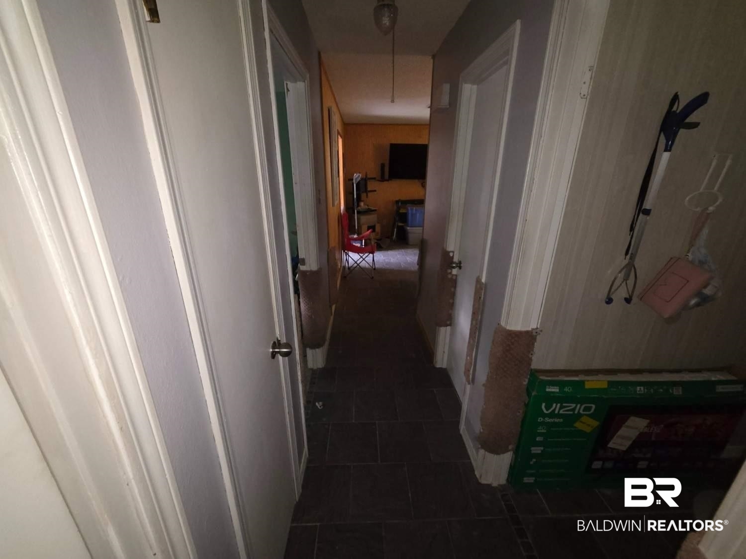 5120 West Celtic Drive Mobile, AL 36619 - Photo 16 of 27 Hall featuring dark tile patterned flooring