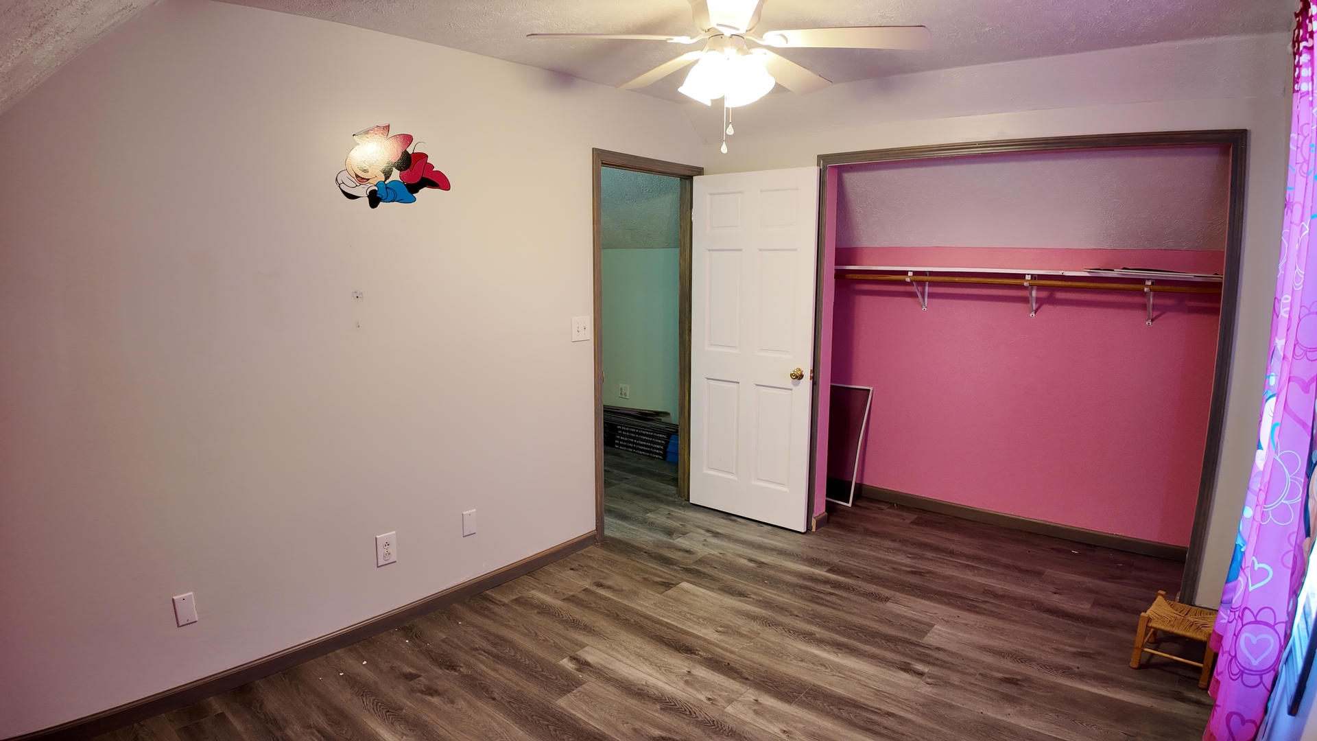 601 East Webster Street Clinton, IL 61727 - Photo 15 of 21 an empty room with wooden floor closet and fan