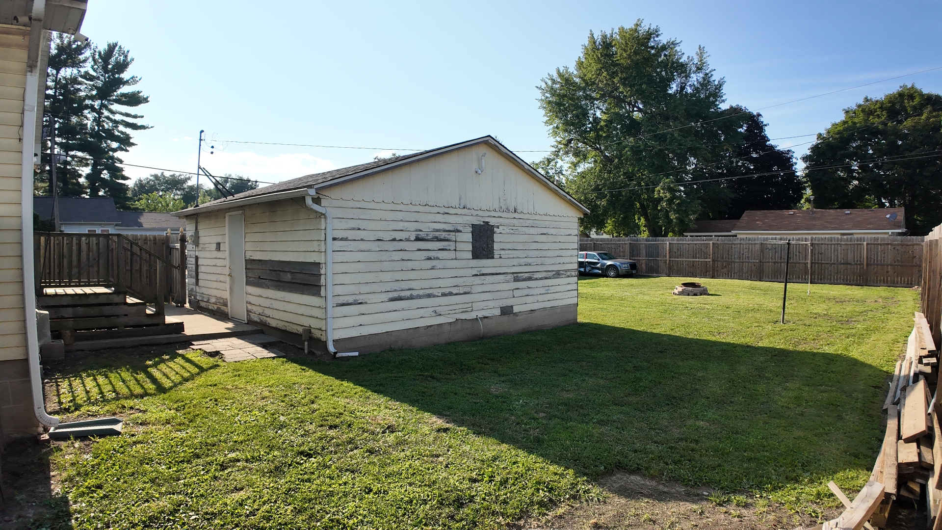 601 East Webster Street Clinton, IL 61727 - Photo 17 of 21 a view of a backyard with a garden